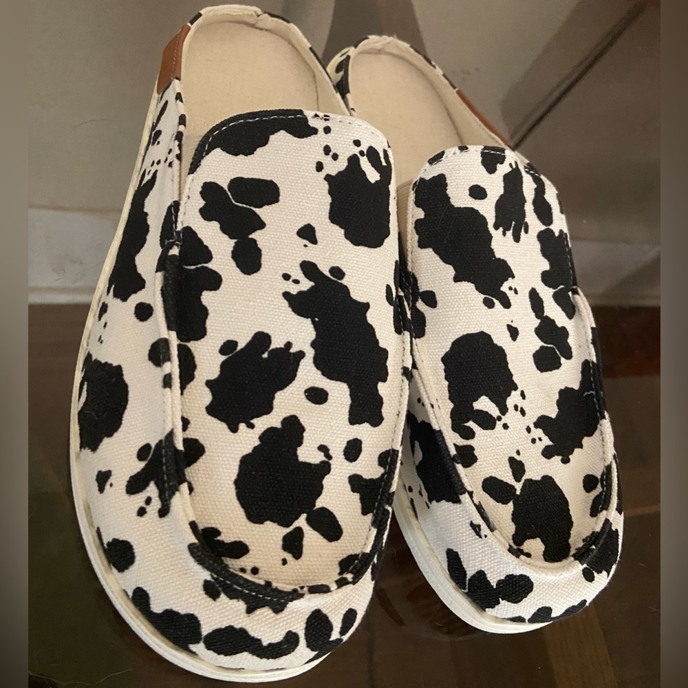 Cow print slip ons
